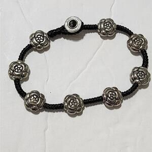 Gorgeous black leather and sober tone floral rosettes bracelet